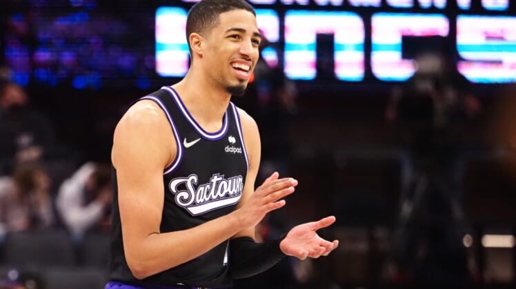 Dec 28, 2021; Sacramento, California, USA; Sacramento Kings guard Tyrese Haliburton (0) claps his hands after a play against the Oklahoma City Thunder during the fourth quarter at Golden 1 Center. Mandatory Credit: Kelley L Cox-USA TODAY Sports