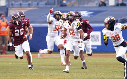 Dec 29, 2021; New York, NY, USA; Maryland Terrapins punt returner Tarheeb Still (12) returns a punt for a touchdown during the first half during the 2021 Pinstripe Bowl against the Virginia Tech Hokies at Yankee Stadium. Mandatory Credit: Vincent Carchietta-USA TODAY Sports
