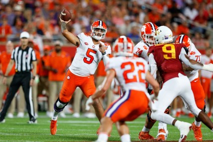 Dec 29, 2021; Orlando, Florida, USA;  Clemson Tigers quarterback D.J. Uiagalelei (5) drops back to pass in the first half against the Iowa State Cyclones at Camping World Stadium. Mandatory Credit: Nathan Ray Seebeck-USA TODAY Sports