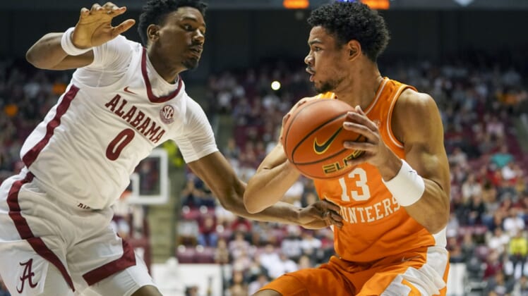 Dec 29, 2021; Tuscaloosa, Alabama, USA; Tennessee Volunteers forward Olivier Nkamhoua (13) controls the ball against Alabama Crimson Tide forward Noah Gurley (0) during the first half at Coleman Coliseum. Mandatory Credit: Marvin Gentry-USA TODAY Sports