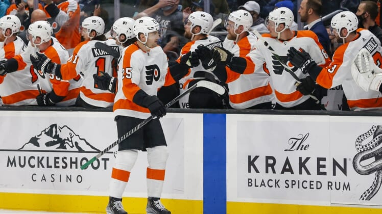 Dec 29, 2021; Seattle, Washington, USA; Philadelphia Flyers left wing James van Riemsdyk (25) celebrates with teammates on the bench after scoring a goal against the Seattle Kraken during the third period at Climate Pledge Arena. Mandatory Credit: Joe Nicholson-USA TODAY Sports