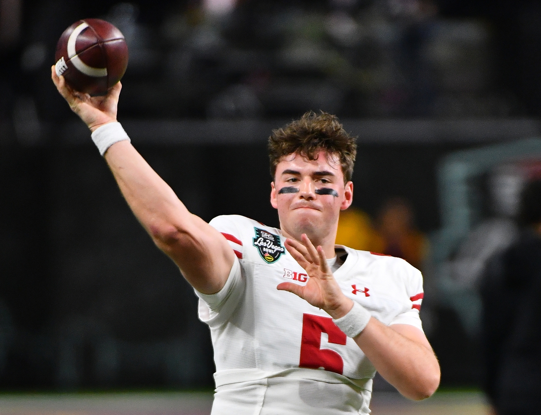 Dec 30, 2021; Paradise, Nevada, USA; Wisconsin Badgers quarterback Graham Mertz (5) warms up before facing the Arizona State Sun Devils in the 2021 Las Vegas Bowl at Allegiant Stadium. Mandatory Credit: Stephen R. Sylvanie-USA TODAY Sports