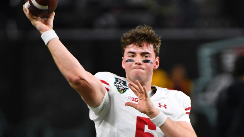 Dec 30, 2021; Paradise, Nevada, USA; Wisconsin Badgers quarterback Graham Mertz (5) warms up before facing the Arizona State Sun Devils in the 2021 Las Vegas Bowl at Allegiant Stadium. Mandatory Credit: Stephen R. Sylvanie-USA TODAY Sports