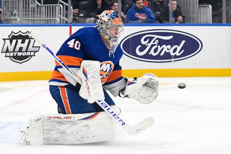 Dec 30, 2021; Elmont, New York, USA;  New York Islanders goaltender Semyon Varlamov (40) makes a save against the Buffalo Sabres during the third period at UBS Arena. Mandatory Credit: Dennis Schneidler-USA TODAY Sports