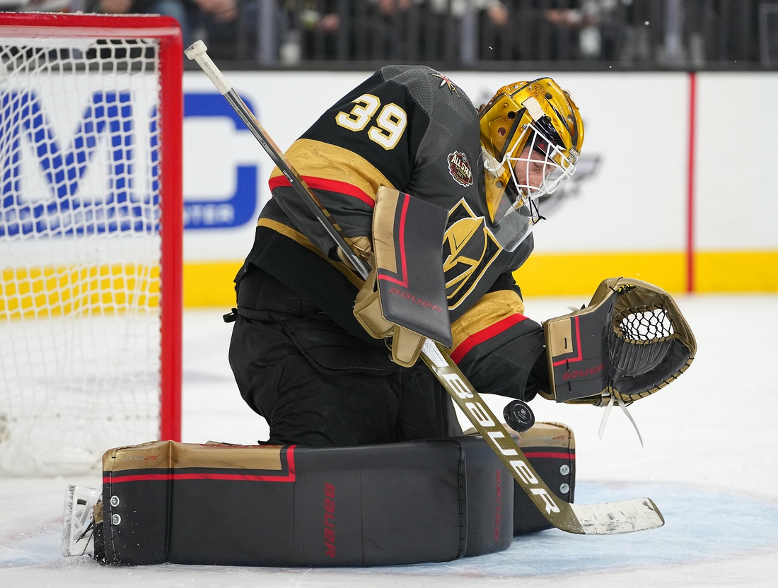 Dec 31, 2021; Las Vegas, Nevada, USA; Vegas Golden Knights goaltender Laurent Brossoit (39) makes a first period save against the Anaheim Ducks at T-Mobile Arena. Mandatory Credit: Stephen R. Sylvanie-USA TODAY Sports