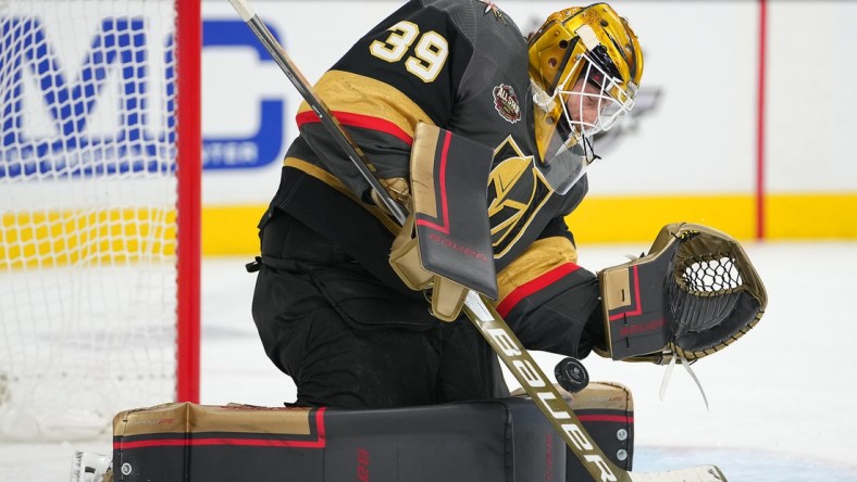 Dec 31, 2021; Las Vegas, Nevada, USA; Vegas Golden Knights goaltender Laurent Brossoit (39) makes a first period save against the Anaheim Ducks at T-Mobile Arena. Mandatory Credit: Stephen R. Sylvanie-USA TODAY Sports