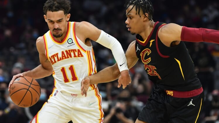 Dec 31, 2021; Cleveland, Ohio, USA; Atlanta Hawks guard Trae Young (11) drives to the basket against Cleveland Cavaliers forward Isaac Okoro (35) during the first half at Rocket Mortgage FieldHouse. Mandatory Credit: Ken Blaze-USA TODAY Sports
