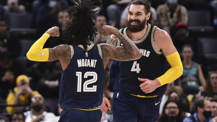 Dec 31, 2021; Memphis, Tennessee, USA; Memphis Grizzlies center Steven Adams (4) and guard Ja Morant (12) celebrate during the first half against the San Antonio Spurs at FedExForum. Mandatory Credit: Justin Ford-USA TODAY Sports
