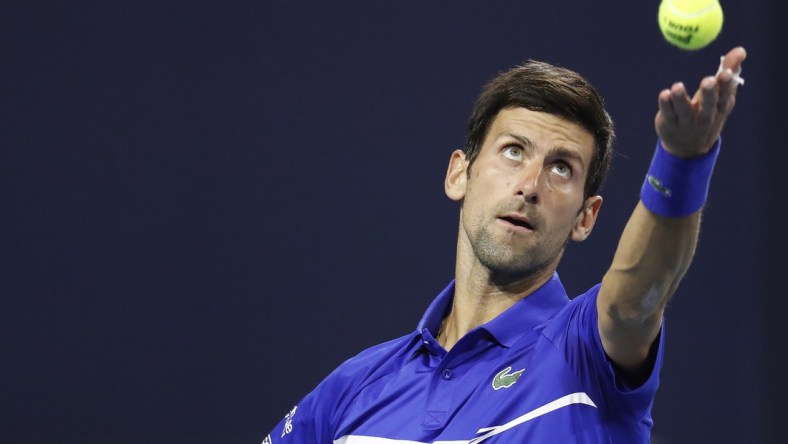 Mar 22, 2019; Miami Gardens, FL, USA; Novak Djokovic of Serbia serves against Bernard Tomic of Australia (not pictured) in the second round of the Miami Open at Miami Open Tennis Complex. Mandatory Credit: Geoff Burke-USA TODAY Sports