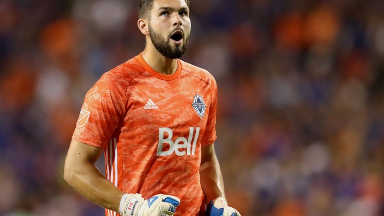 Aug 3, 2019; Cincinnati, OH, USA; Vancouver Whitecaps goalkeeper Maxime Crepeau (16) reacts to the goal scored by midfielder Felipe Martins (8) against FC Cincinnati in the second half at Nippert Stadium. Mandatory Credit: Aaron Doster-USA TODAY Sports