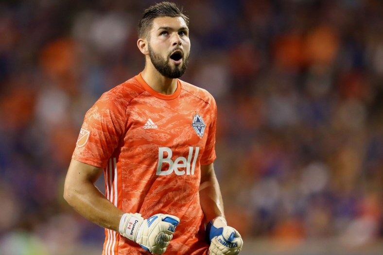 Aug 3, 2019; Cincinnati, OH, USA; Vancouver Whitecaps goalkeeper Maxime Crepeau (16) reacts to the goal scored by midfielder Felipe Martins (8) against FC Cincinnati in the second half at Nippert Stadium. Mandatory Credit: Aaron Doster-USA TODAY Sports