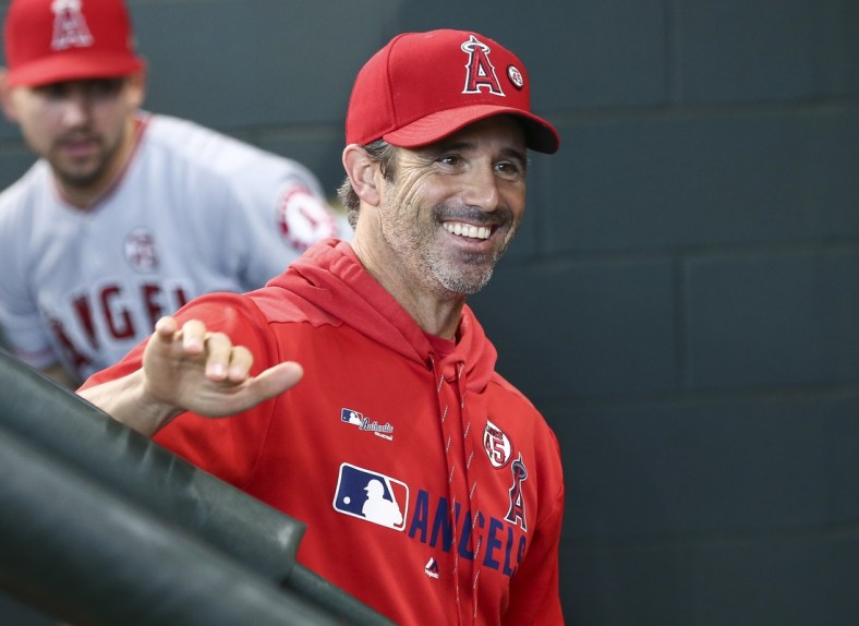 Sep 22, 2019; Houston, TX, USA; Los Angeles Angels manager Brad Ausmus (12) smiles in the dugout before a game against the Houston Astros at Minute Maid Park. Mandatory Credit: Troy Taormina-USA TODAY Sports