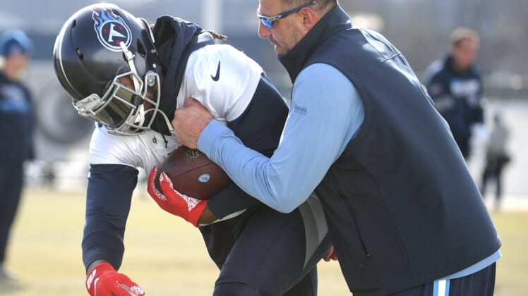 Titans head coach Mike Vrabel and running back Derrick Henry  (22)  run drills during practice at Saint Thomas Sports Park In Nashville on Thursday, Jan. 16, 2020.Sem 0465