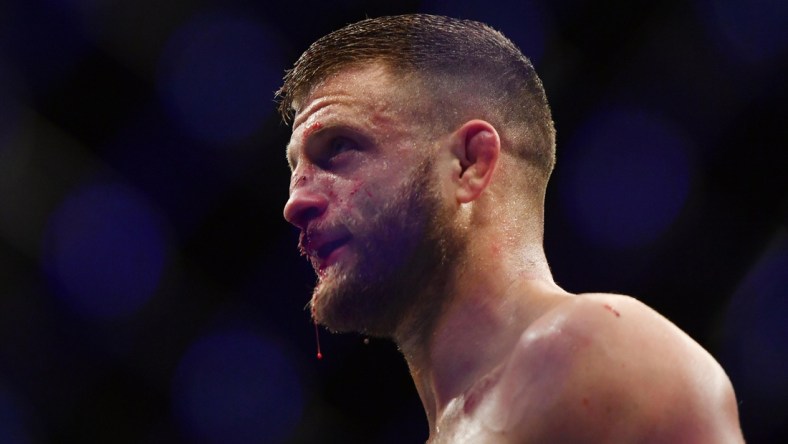 May 9, 2020; Jacksonville, Florida, USA;  Calvin Kattar (blue gloves) defeats Jeremy Stephens (red gloves) during UFC 249 at VyStar Veterans Memorial Arena. Mandatory Credit: Jasen Vinlove-USA TODAY Sports