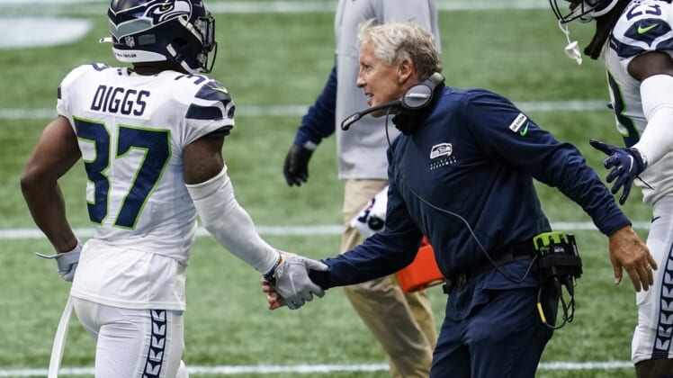 Sep 13, 2020; Atlanta, Georgia, USA; Seattle Seahawks head coach Pete Carroll reacts with strong safety Quandre Diggs (37) after a play against the Atlanta Falcons during the second half at Mercedes-Benz Stadium. Mandatory Credit: Dale Zanine-USA TODAY Sports