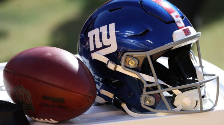 Nov 8, 2020; Landover, Maryland, USA; A New York Giants helmet next to a ball on the sidelines. Mandatory Credit: Geoff Burke-USA TODAY Sports