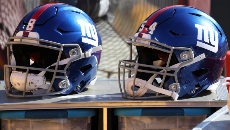 Nov 8, 2020; Landover, Maryland, USA; A view of the helmets of New York Giants quarterback Daniel Jones (8) and Giants inside linebacker Blake Martinez (54) resting on equipment case on the sidelines against the Washington Football Team at FedExField. Mandatory Credit: Geoff Burke-USA TODAY Sports