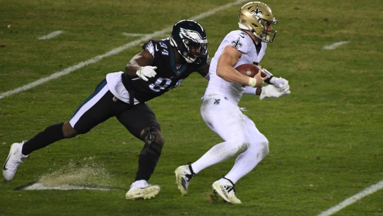 Dec 13, 2020; Philadelphia, Pennsylvania, USA; quarterback Taysom Hill (7) is chased by Philadelphia Eagles defensive end Josh Sweat (94) in the fourth quarter at Lincoln Financial Field. Mandatory Credit: James Lang-USA TODAY Sports