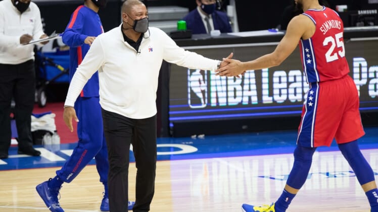 Jan 27, 2021; Philadelphia, Pennsylvania, USA; Philadelphia 76ers guard Ben Simmons (25) and head coach Doc Rivers (L) during the third quarter against the Los Angeles Lakers at Wells Fargo Center. Mandatory Credit: Bill Streicher-USA TODAY Sports