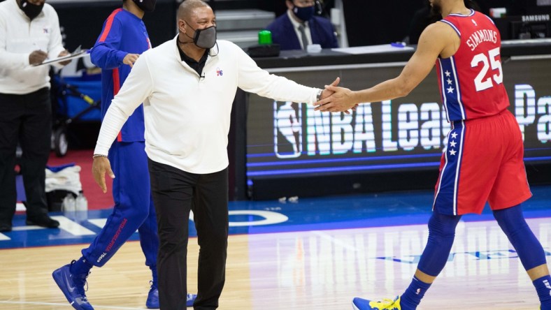 Jan 27, 2021; Philadelphia, Pennsylvania, USA; Philadelphia 76ers guard Ben Simmons (25) and head coach Doc Rivers (L) during the third quarter against the Los Angeles Lakers at Wells Fargo Center. Mandatory Credit: Bill Streicher-USA TODAY Sports