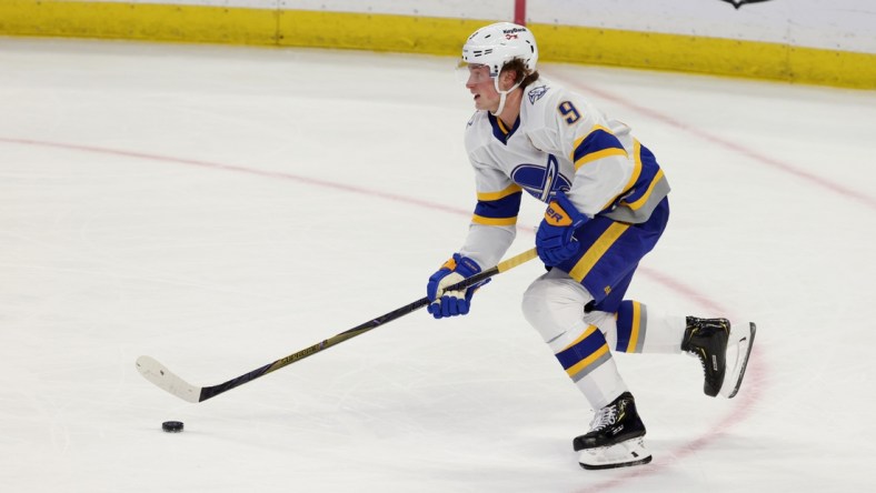 Feb 28, 2021; Buffalo, New York, USA; Buffalo Sabres center Jack Eichel (9) skates up the ice with the puck against the Philadelphia Flyers during the second period at KeyBank Center. Mandatory Credit: Timothy T. Ludwig-USA TODAY Sports