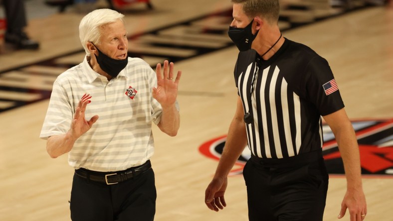 Mar 6, 2021; Richmond, Virginia, USA; Davidson Wildcats head coach Bob McKillop (L) argues with an official against the VCU Rams in the first half in a semifinal of the Atlantic 10 conference tournament at Stuart C. Siegel Center. Mandatory Credit: Geoff Burke-USA TODAY Sports