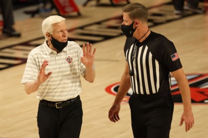 Mar 6, 2021; Richmond, Virginia, USA; Davidson Wildcats head coach Bob McKillop (L) argues with an official against the VCU Rams in the first half in a semifinal of the Atlantic 10 conference tournament at Stuart C. Siegel Center. Mandatory Credit: Geoff Burke-USA TODAY Sports