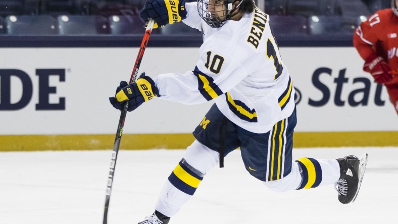 Mar 14, 2021; South Bend, IN, USA; Michigan's Matty Beniers (10) shoots during the Michigan vs. Ohio State Big Ten Hockey Tournament game Sunday, March 14, 2021 at the Compton Family Ice Arena in South Bend.  Mandatory Credit: Michael Caterina-USA TODAY Sports