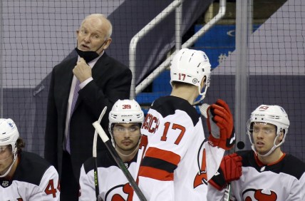 Mar 21, 2021; Pittsburgh, Pennsylvania, USA;  New Jersey Devils head coach Lindy Ruff (left) talks to center Yegor Sharangovich (17) against the Pittsburgh Penguins during the second period at PPG Paints Arena. New Jersey won 2-1 in overtime. Mandatory Credit: Charles LeClaire-USA TODAY Sports