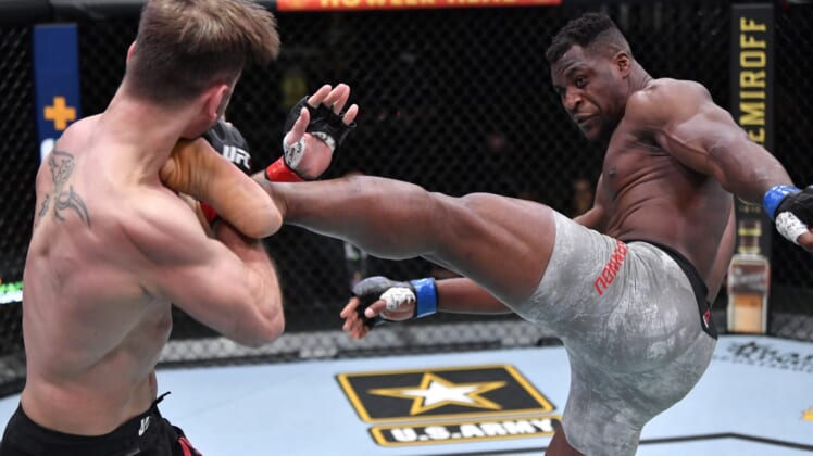 Mar 27, 2021; Las Vegas, NV, USA; Francis Ngannou of Cameroon kicks Stipe Miocic in their UFC heavyweight championship fight during the UFC 260 event at UFC APEX on March 27, 2021 in Las Vegas, Nevada.   Mandatory Credit: Jeff Bottari/Handout Photo via USA TODAY Sports