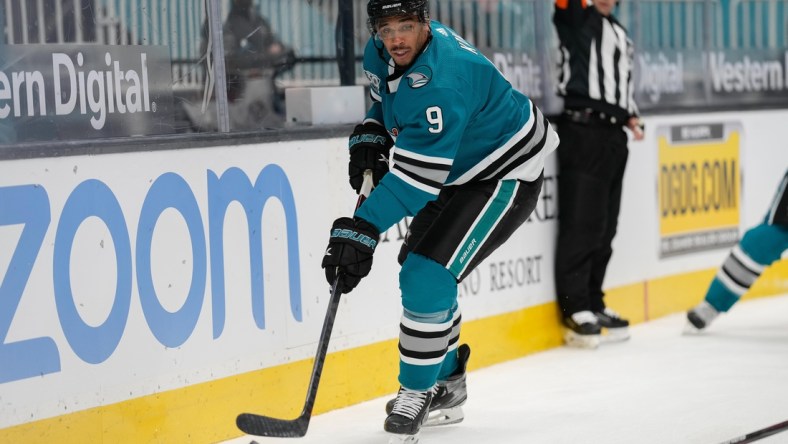 May 7, 2021; San Jose, California, USA;  San Jose Sharks left wing Evander Kane (9) controls the puck during the first period against the Arizona Coyotes at SAP Center at San Jose. Mandatory Credit: Stan Szeto-USA TODAY Sports