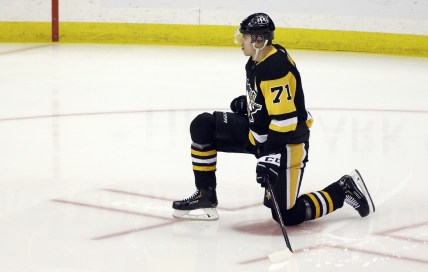 May 8, 2021; Pittsburgh, Pennsylvania, USA;  Pittsburgh Penguins center Evgeni Malkin (71) stretches on the ice before playing the Buffalo Sabres at PPG Paints Arena. Mandatory Credit: Charles LeClaire-USA TODAY Sports