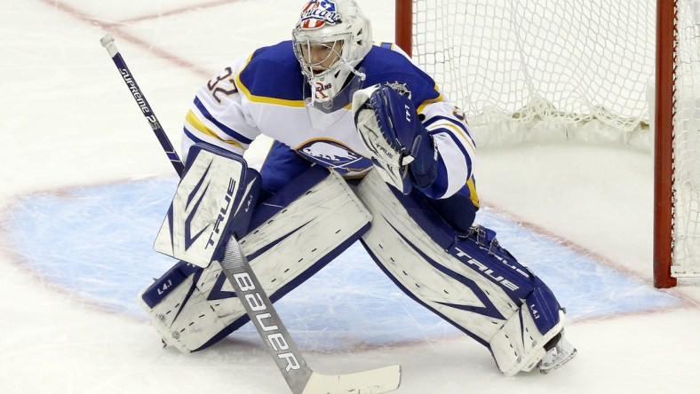 May 6, 2021; Pittsburgh, Pennsylvania, USA;  Buffalo Sabres goaltender Michael Houser (32) guards the net against the Pittsburgh Penguins during the first period at PPG Paints Arena. Mandatory Credit: Charles LeClaire-USA TODAY Sports