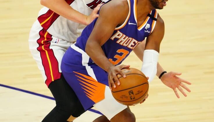 Apr 13, 2021; Phoenix, Arizona, USA; Phoenix Suns guard Chris Paul (3) against Miami Heat guard Duncan Robinson at Phoenix Suns Arena. Mandatory Credit: Mark J. Rebilas-USA TODAY Sports