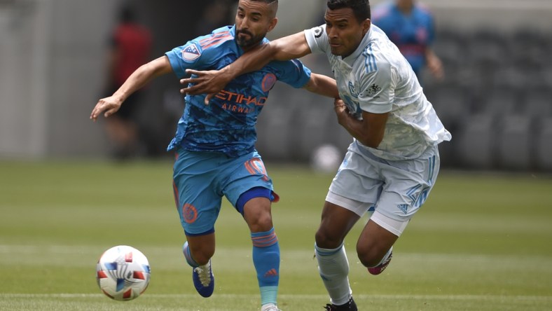 May 29, 2021; Los Angeles, CA, USA; New York City FC midfielder Maxi Moralez (10) moves the ball while pressured by Los Angeles FC defender Eddie Segura (4) during the first half at Banc of California Stadium. Mandatory Credit: Kelvin Kuo-USA TODAY Sports