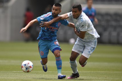 May 29, 2021; Los Angeles, CA, USA; New York City FC midfielder Maxi Moralez (10) moves the ball while pressured by Los Angeles FC defender Eddie Segura (4) during the first half at Banc of California Stadium. Mandatory Credit: Kelvin Kuo-USA TODAY Sports