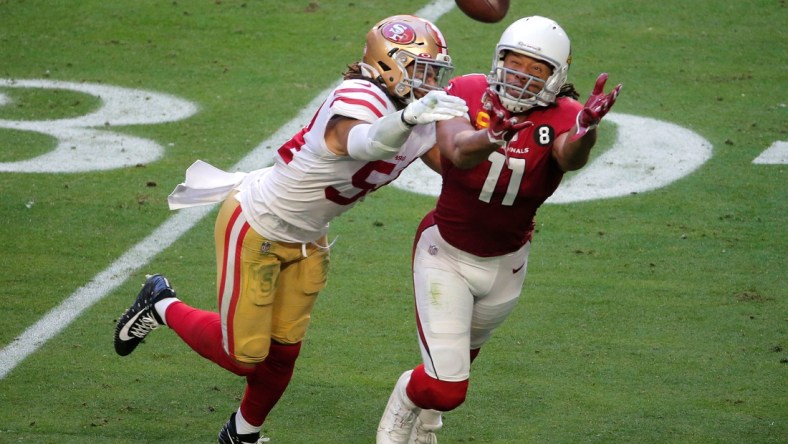 Dec 26, 2020; Glendale, AZ, USA;  San Francisco 49ers linebacker Fred Warner (54) keeps Arizona Cardinals wide receiver Larry Fitzgerald (11) from making a catch at State Farm Stadium. Mandatory Credit: Cheryl Evans-Arizona Republic

Nfl San Francisco 49ers At Arizona Cardinals