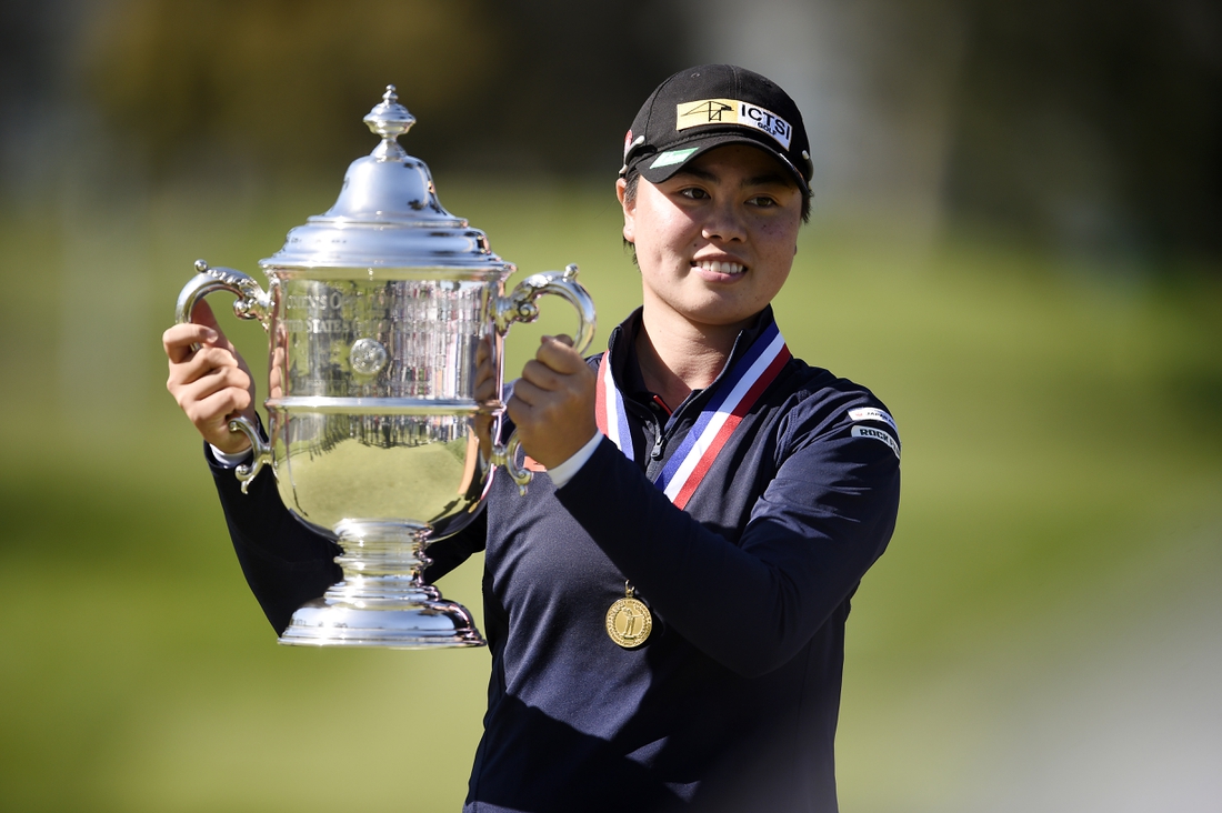 Jun 6, 2021; San Francisco, California, USA; Yuka Saso hoists the US Open trophy after winning in a sudden death playoff over Nasa Hataoka following the final round of the U.S. Women's Open golf tournament at The Olympic Club. Mandatory Credit: Kelvin Kuo-USA TODAY Sports