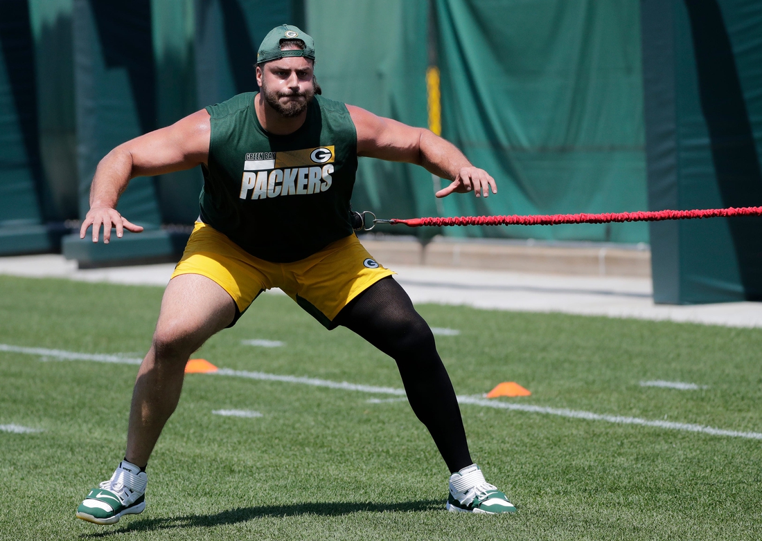 Green Bay Packers offensive tackle David Bakhtiari (69) walks on