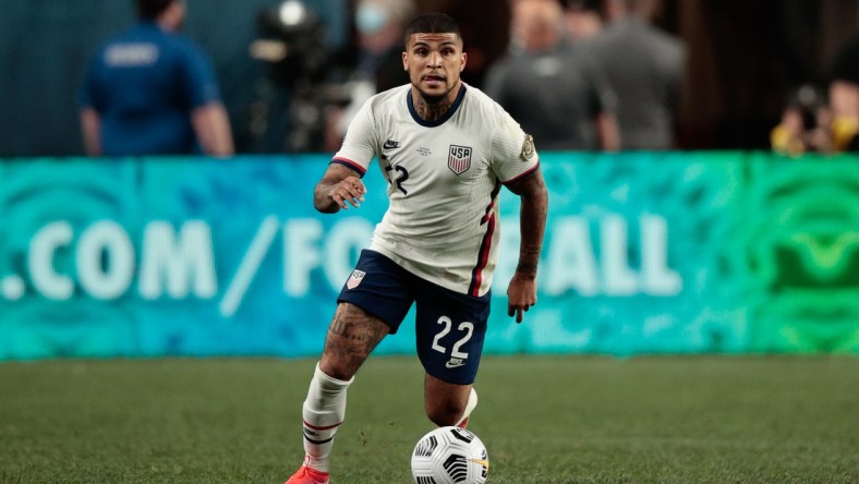 Jun 6, 2021; Denver, Colorado, USA; United States defender Deandre Yedlin (22) controls the ball in the second half against Mexico during the 2021 CONCACAF Nations League Finals soccer series final match at Empower Field at Mile High. Mandatory Credit: Isaiah J. Downing-USA TODAY Sports