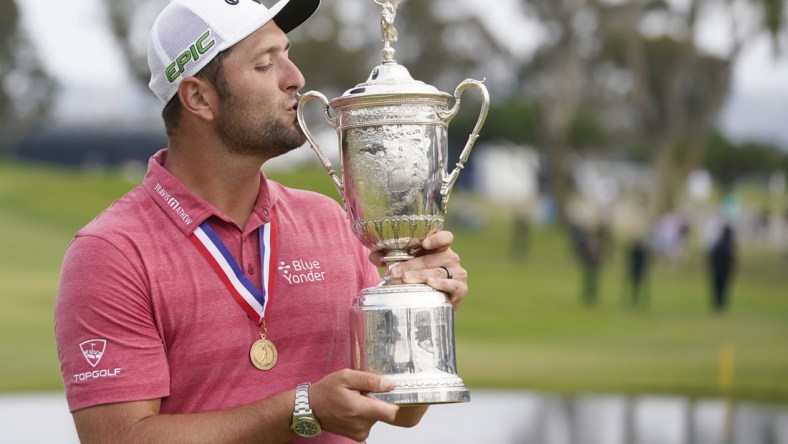 Jun 20, 2021; San Diego, California, USA; Jon Rahm celebrates and kisses the trophy after winning he U.S. Open golf tournament at Torrey Pines Golf Course. Mandatory Credit: Michael Madrid-USA TODAY Sports