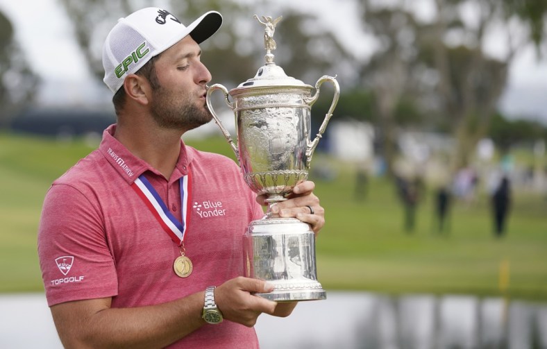 Jun 20, 2021; San Diego, California, USA; Jon Rahm celebrates and kisses the trophy after winning he U.S. Open golf tournament at Torrey Pines Golf Course. Mandatory Credit: Michael Madrid-USA TODAY Sports