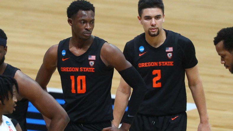 Mar 29, 2021; Indianapolis, Indiana, USA; Oregon State Beavers forward Warith Alatishe (10) and guard Jarod Lucas (2) against the Houston Cougars in the Elite Eight of the 2021 NCAA Tournament at Lucas Oil Stadium. Mandatory Credit: Mark J. Rebilas-USA TODAY Sports