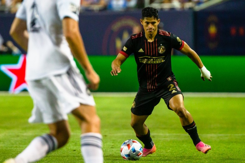 Jul 3, 2021; Chicago, Illinois, USA; Atlanta United defender Ronald Hernandez (2) dribbles the ball against the Chicago Fire during the second half at Soldier Field. Mandatory Credit: Jon Durr-USA TODAY Sports