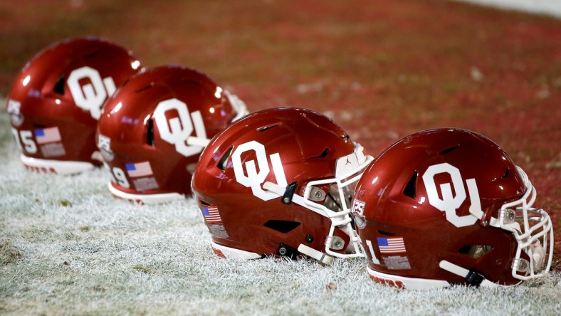 Helmets sit on the field before an NCAA football game between the University of Oklahoma Sooners (OU) and the TCU Horned Frogs at Gaylord Family-Oklahoma Memorial Stadium in Norman, Okla., Saturday, Nov. 23, 2019. Oklahoma won 28-24. [Bryan Terry/The Oklahoman]