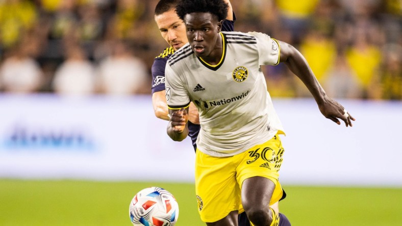 Jul 21, 2021; Columbus, Ohio, USA; Columbus Crew defender Aboubacar Keita (30) dribbles the ball while Nashville SC midfielder Alex Muyl (19) defends in the second half at Lower.com Stadium. Mandatory Credit: Trevor Ruszkowski-USA TODAY Sports