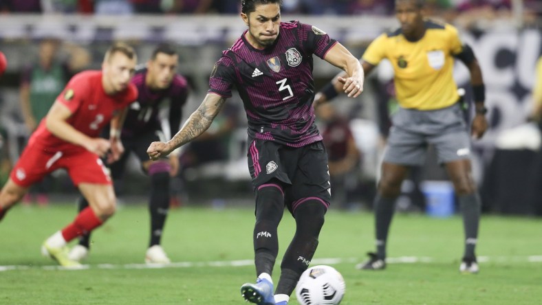 Jul 29, 2021; Houston, Texas, USA; Mexico defender Carlos Salcedo shoots a penalty kick against Canada in the second half during a CONCACAF Gold Cup semifinal soccer match at NRG Stadium. Mandatory Credit: Thomas Shea-USA TODAY Sports