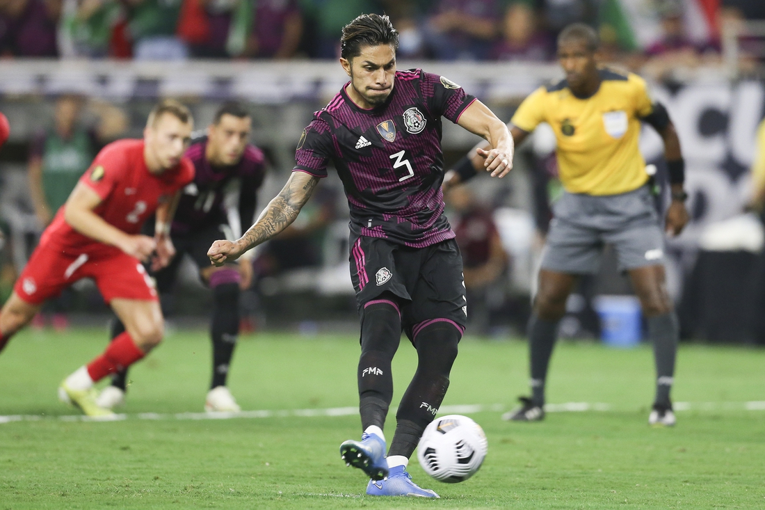 Jul 29, 2021; Houston, Texas, USA; Mexico defender Carlos Salcedo shoots a penalty kick against Canada in the second half during a CONCACAF Gold Cup semifinal soccer match at NRG Stadium. Mandatory Credit: Thomas Shea-USA TODAY Sports