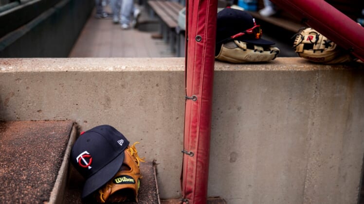 Minnesota Twins hats and gloves sit on the steps of the dugout before the MLB Interleague game between the Cincinnati Reds and the Minnesota Twins at Great American Ball Park in downtown Cincinnati on Wednesday, August 4, 2021.Minnesota Twins At Cincinnati Reds