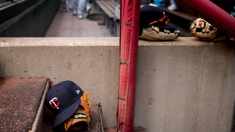 Minnesota Twins hats and gloves sit on the steps of the dugout before the MLB Interleague game between the Cincinnati Reds and the Minnesota Twins at Great American Ball Park in downtown Cincinnati on Wednesday, August 4, 2021.

Minnesota Twins At Cincinnati Reds